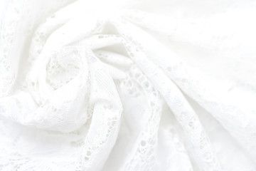 Delicate white background of factory lace fabric, soft focus.