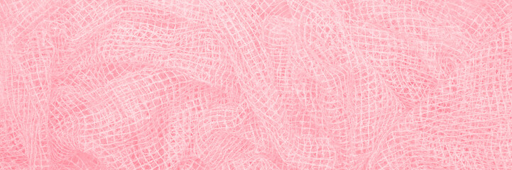 Delicate crumpled fabric, small square texture banner of beautiful pink color, closeup.