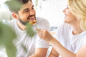 Happy man looking at smiling pretty lady