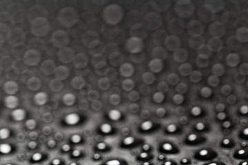 Blured abstract water drops on a dark background