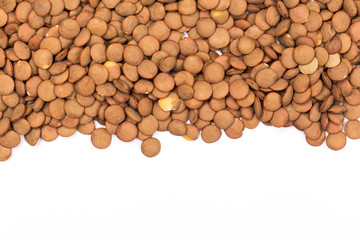 Pile lentil isolated on white background. Top view.