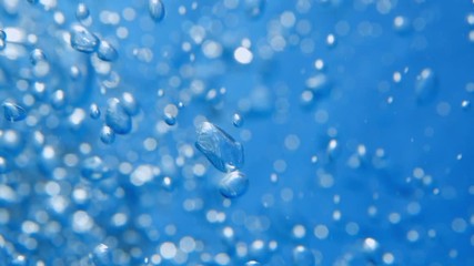 Bubbles rising to the surface. Air bubbles in water in sea (underwater shot), good for backgrounds. Slow motion.