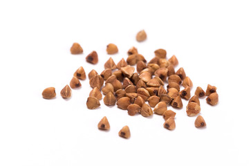 Pile of buckwheat isolated on white background. Top view.