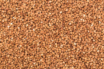Macro Photo food buckwheat groats. Texture background grain buckwheat groats. Image food product porridge buckwheat grains