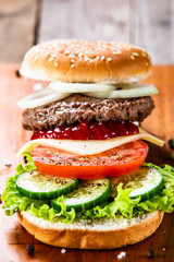 Tasty burger on cutting board