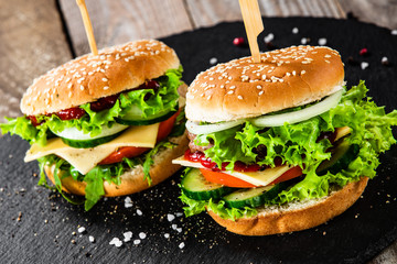 Tasty burgers served black stone plate