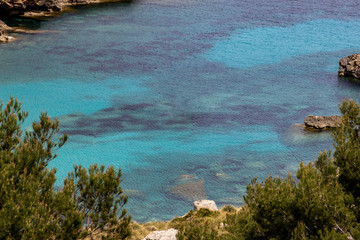 Scenic view on wonderful  rocky bay Cala Figuera on balearic island Mallorca, Spain on a sunny day with clear turquoise water in different colors