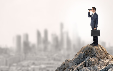 Young business person looking to the city from distance