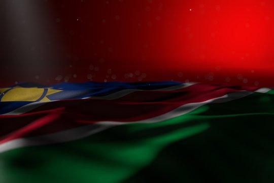 wonderful dark picture of Namibia flag lying on red background with bokeh and free place for content - any celebration flag 3d illustration..