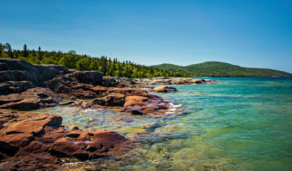 Red Volcanic Rock on the beautiful Rocky Coast of Lake Superior - 286890575