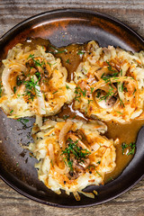 Potato cakes with gravy sauce and champignon