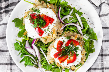 Potato cakes with sour cream and vegetables
