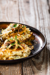 Potato cakes with gravy sauce and champignon