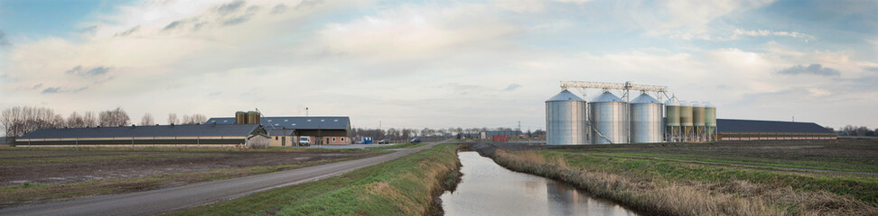 Fototapeta na wymiar Poultry farm with silos panorama