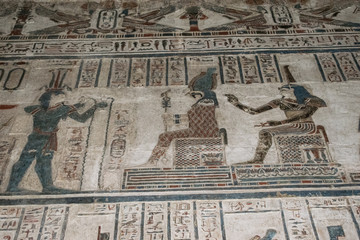 Ancient Egyptian hieroglyphics and wall drawings at Dendera temple, Luxor, Egypt.