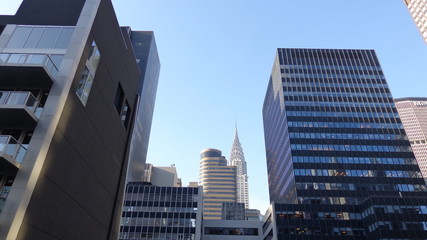 Fototapeta na wymiar New York City Buildings With Blue Sky Background