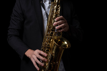Obraz na płótnie Canvas Male Jazz Saxophone Player Performance on the Stage.