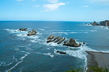 View of the geological formations of the wild beach of La Gueir&uacute;a.