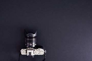 Camera, Tablet and mobile phone with green screen, dark background.