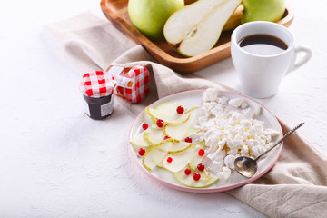Breakfast with coffee. cottage cheese with slices of pear, Apple and cranberries
