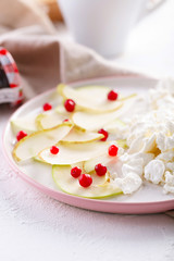cottage cheese with slices of pear, Apple and cranberries