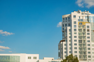 urban modern city poster concept picture of white large tower office building frame on blue sky background with empty space for copy or text 