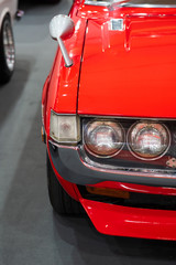 Close up Color detail on the headlight of a vintage car