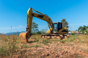 Yellow excavator construction truck