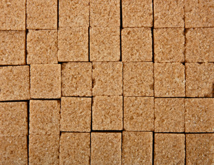 Background texture pattern of brown sugar cubes