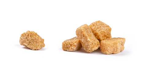 Close up brown sugar cubes isolated on white