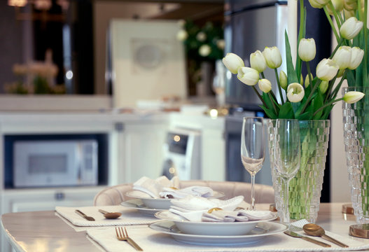 Preparing Dishware On Romantic Dinner Table