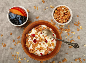 Portion of muesli granola breakfast with yogurt