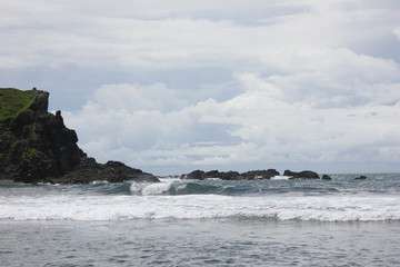 Fototapeta na wymiar The Beautiful Cliff on the Beach at Seruni Jogyakarta Indonesia