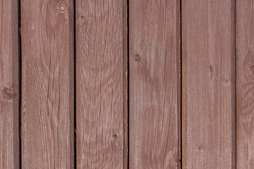 A texture of brown boards with knots and resin painted with impregnation for wood