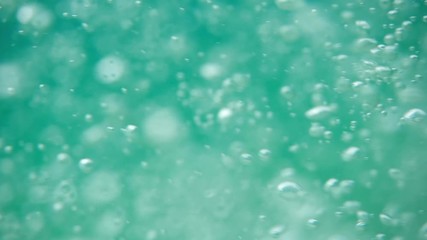 Bubbles rising to the surface. Air bubbles in water in sea (underwater shot), good for backgrounds. Slow motion.