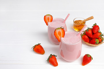 Strawberry smoothies colorful fruit juice beverage healthy the taste yummy In glass drink episode morning on white background.