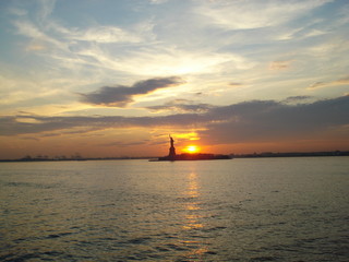 Sunset Featuring The Statue Of Liberty