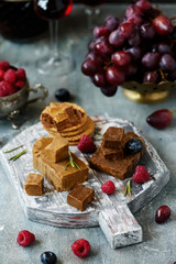 Norwegian cheese brunost on the cutting board. selective focus