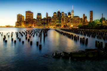 Fototapeta na wymiar Old Pier 1 and lower Manhattan, an incredible relationship