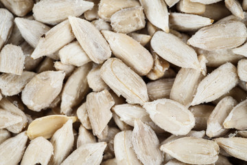 peeled sunflower seeds as background