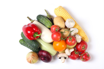 Set of different fresh vegetables on a white background top view.