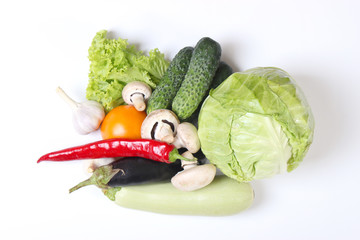 Set of different fresh vegetables on a white background top view.