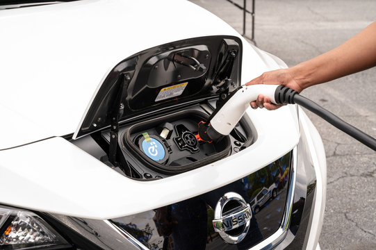 Plugging in Nissan Leaf Electric Car