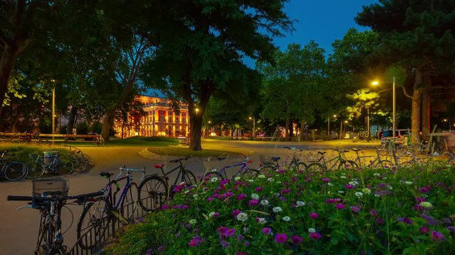 vienna city evening illuminated central park square flowers panorama 4k timelapse austria