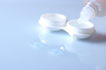 lenses for vision correction and a container for storing lenses. Contact lenses.