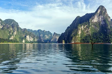 Fototapeten Sommer Limestone mountain range and lake in afternoon light  © oppdowngalon