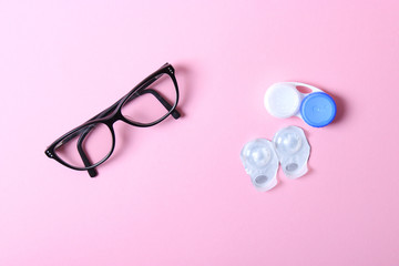 Glasses and lenses for correcting vision on a colored background.