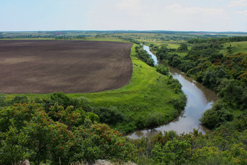 Steppe landscape with field and river