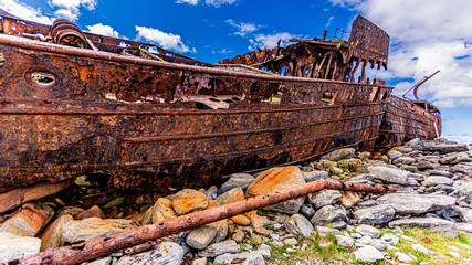Detailed side view of the Plassey shipwreck on the rocky beach of Inis Oirr island, abandoned ship,...
