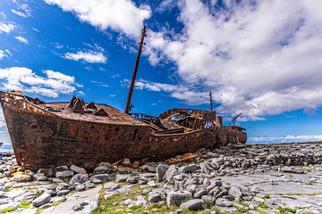 Stunning view of the Plassey shipwreck on the rocky beach of Inis Oirr island, abandoned ship, old,...